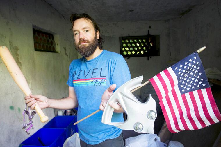 Bradley Maule, editor of Hidden City collects trash within Wissahickon Park for future exihibit. Photograph taken along the trail into park starting at Chestnut Hill Ave and Seminole in Chestnut Hills section of Philadelphia on Wednesday, September 10, 2014. ( ALEJANDRO A. ALVAREZ / STAFF PHOTOGRAPHER )