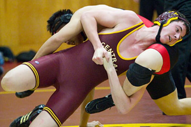 Central's Dylan Delaney drives Northeast's Michael Wang to the mat during their 182-pound weightclass match. (Ed Hille/Staff Photographer)