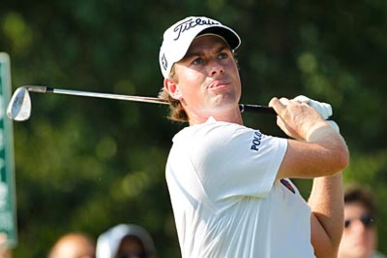 Webb Simpson watches his tee shot on the 18th hole during second round of the Greenbrier Classic. (Steve Helber/AP)