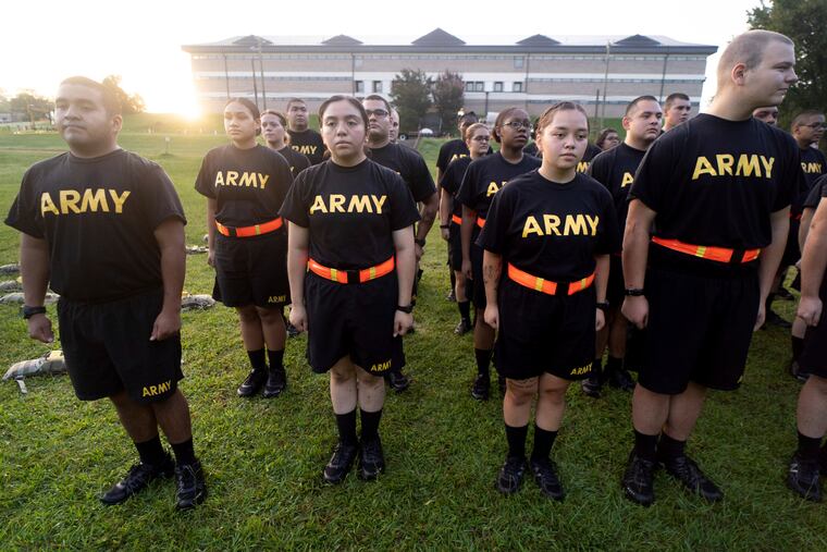 Students in the new Army prep course stand at attention after physical training exercises at Fort Jackson in Columbia, S.C., on Aug. 27, 2022.