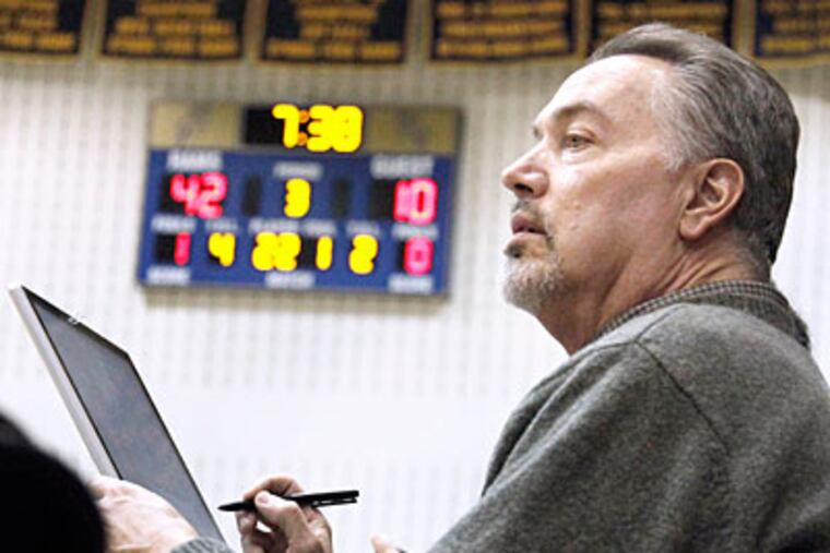 Spring-Ford's girls' assistant basketball coach Randy Doaty inputs every play into a computer. (Elizabeth Robertson/Staff Photographer)