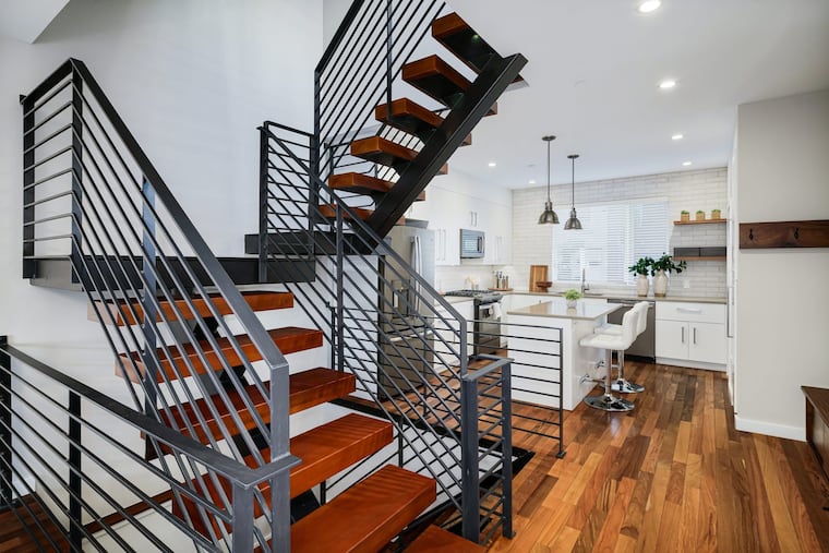 The floating staircase acts as a centerpiece through the home, extending into the finished basement.