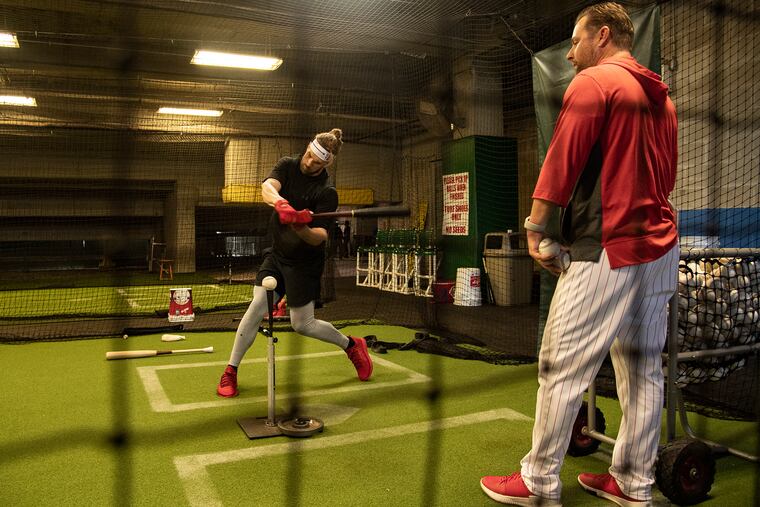 Bryce Harper reported to spring training and went right to work in the batting cage.