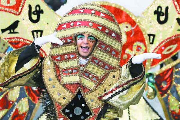 A member of Hog Island Fancy Brigade dances to "Walk like an Egyptian" during their performance. Coverage of the 113th Annual Mummer's parade. PPARADE02 01/01/2013 ( MICHAEL BRYANT / Staff Photographer )