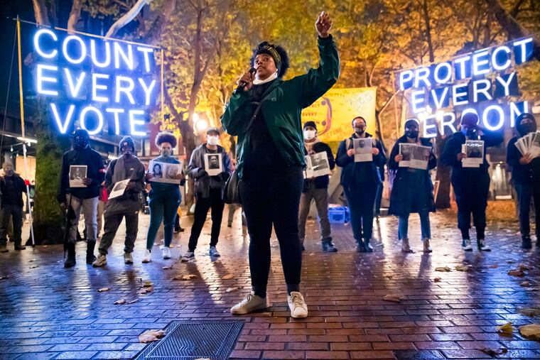 Travonna Thompson-Wiley, with Black Action Coalition, speaks at the Count Every Vote - Protect Every Person rally and march in Occidental Park in Seattle in November 2020.