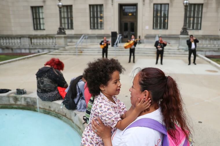 Samantha Espinosa, 4, dances with Esmeralda Martinez while the Toros Mariachi Band performs.