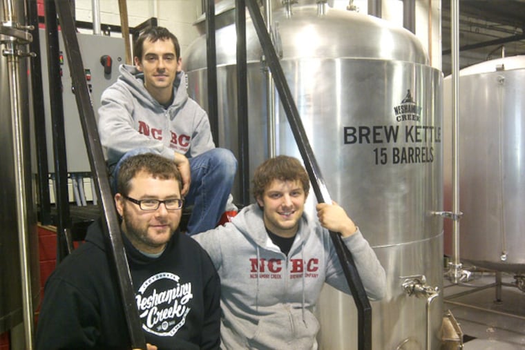 Neshaminy Creek Brewing Co. brewmaster Jeremy Myers (left), with assistants Steve Capelli (rear) and RobJahn (right).