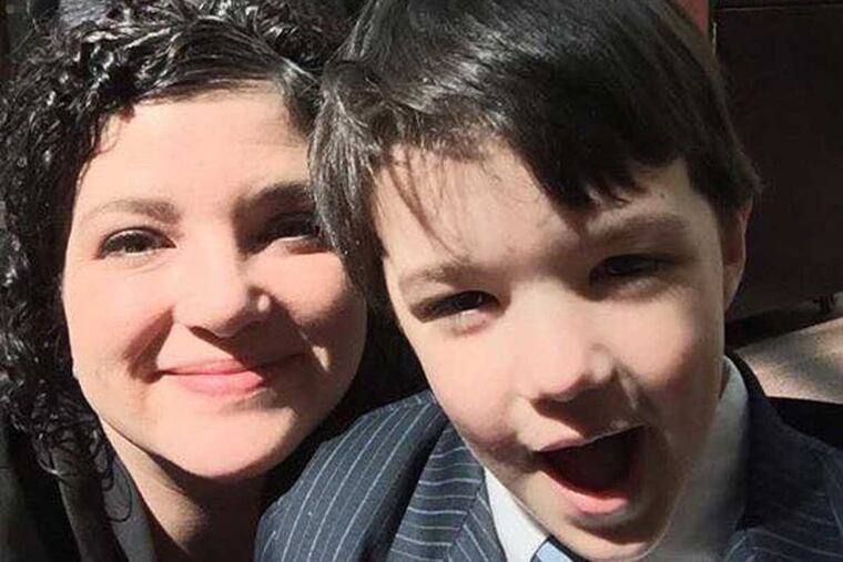 Cara Salemme, president of Campaign for Compassion, with her son Cooper in Harrisburg in April 2016.