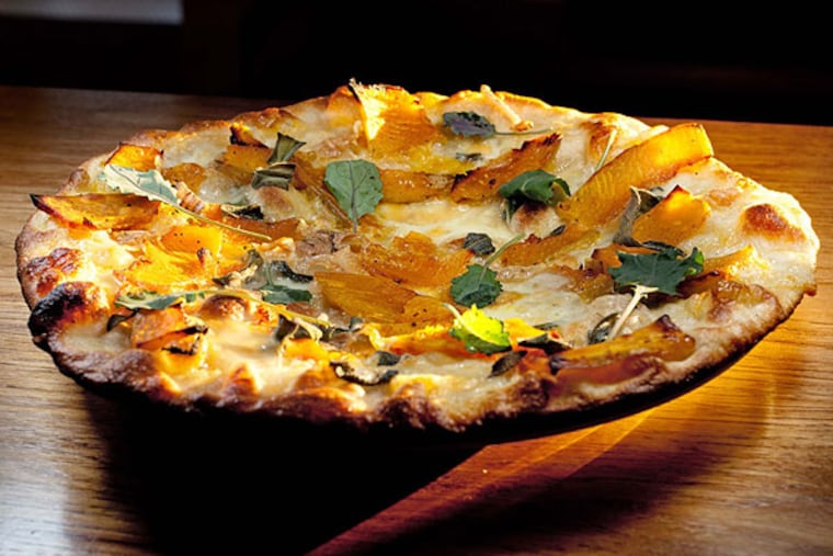 Winter squash "bar pie" with arugula, brown butter, sage at Farm & Fisherman Tavern + Market in Cherry Hill.