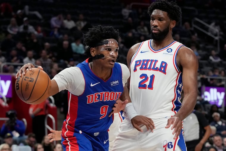 Detroit Pistons forward Ausar Thompson drives as 76ers center Joel Embiid defends during the first half on Dec. 13 in Detroit.