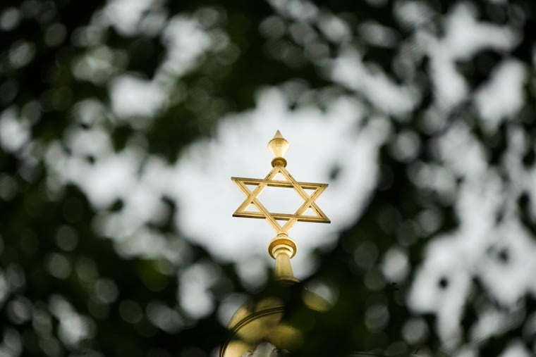 The sun shines on a Star of David.
