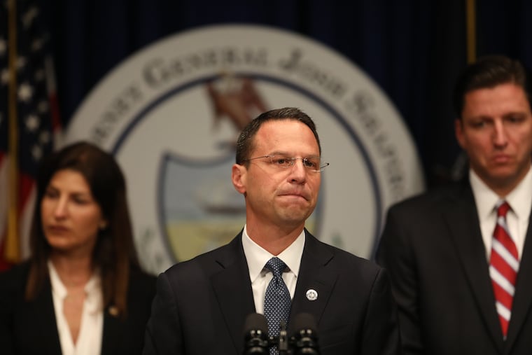 Pennsylvania Attorney General Josh Shapiro is flanked by members of his investigative team, including Daniel Dye, right, who has spent more than four years investigating clergy abuse for the office, beginning under Shapiro's predecessor, Kathleen Kane.