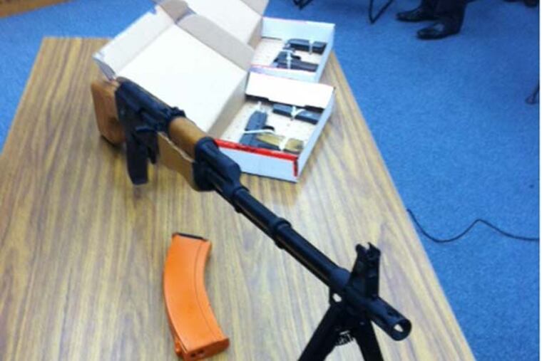 A replica AK-47 rifle and two working, World War II-vintage 9mm handguns
were confiscated from the bedroom of a Council Rock South High School
student on Thursday, after he allegedly threatened to kill students and staffers,
police said. (Bill Reed/Staff)