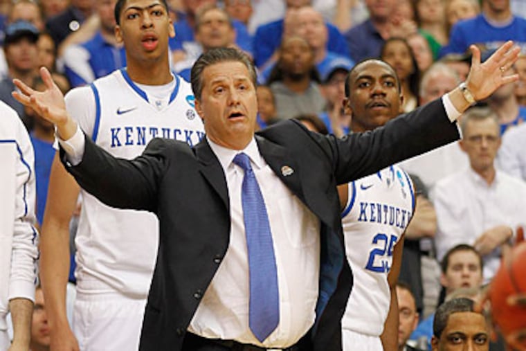 Kentucky faces Louisville in the first game of the Final Four on Saturday night. (John Bazemore/AP)
