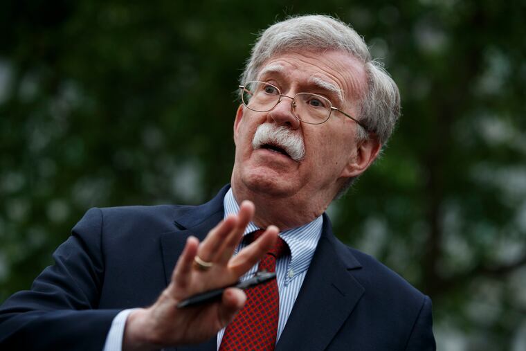 National security adviser John Bolton talks to reporters about Venezuela, outside the White House, Wednesday, May 1, 2019, in Washington.