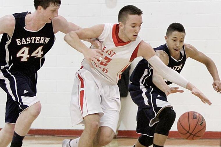 Eastern's # 44 Matt Klinewski and # 11 Alex Barr battle Cherry Hill
East's # 42 Tommy Smierciak for a loose ball in the 4th quarter of the
Eastern at Cherry Hill East H.S. SJ Group 4 semifinal boys basketball
game on March 8, 2014. A foul was called on Barr during the play and
Cherry Hill East won the game 44-37. ( ELIZABETH ROBERTSON / Staff
Photographer )