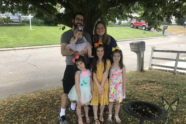 The Kruger family: Pete (holding Daphne) and Bridget with (from left) Lorelei, Colette and Noelle.