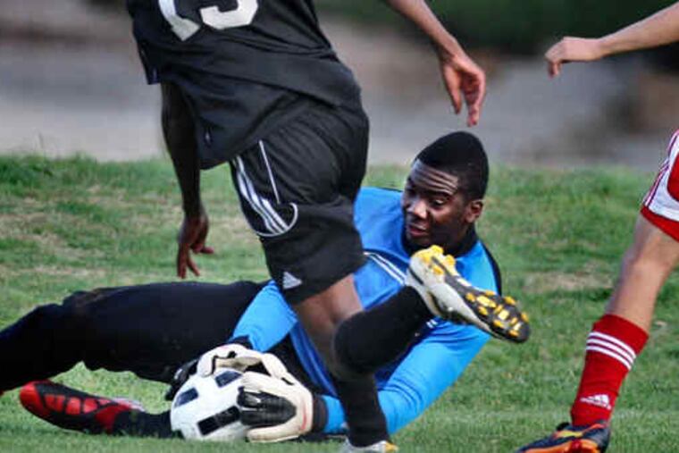 Pennsauken goalie DaQuan DeSesso comes out of the net to make a save on a shot by Bishop Eustace's Marc Montenard. DeSesso is just beginning to attract attention in the sport.
