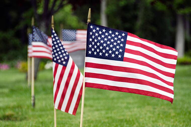 Many military graves in Huntingdon Valley's Forest Hills Cemetery were insultingly without traditional American flags on Memorial Day. (RACHEL WISNIEWSKI / Staff Photographer / File photo)