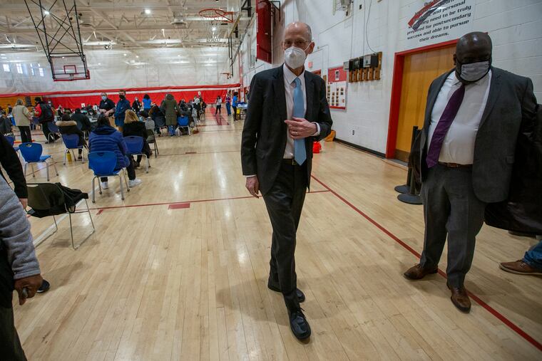 Philadelphia Health Commissioner Thomas Farley and Managing Director Tumar Alexander visit a city-run COVID-19 vaccination clinic at Simon Gratz Mastery Charter School in North Philadelphia last month.