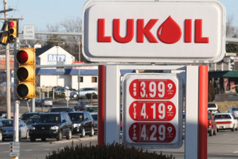 A Lukoil station on Ridge Pike in Conshohocken is selling regular gasoline for $3.99 per gallon. (Charles Fox / Staff Photographer)