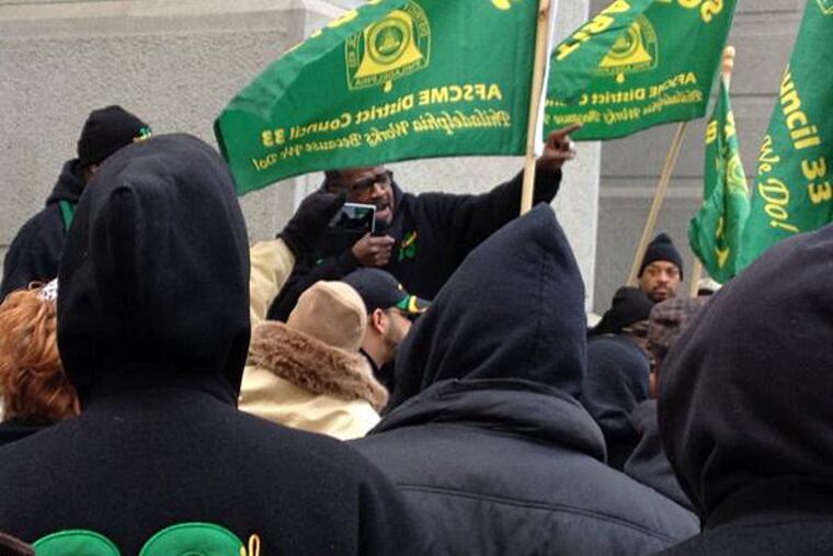 District Council 33 President Pete Matthews addresses unionized workers gathered outside City Hall to protest Mayor Nutter's annual budget address on Thursday, March, 6, 2014.