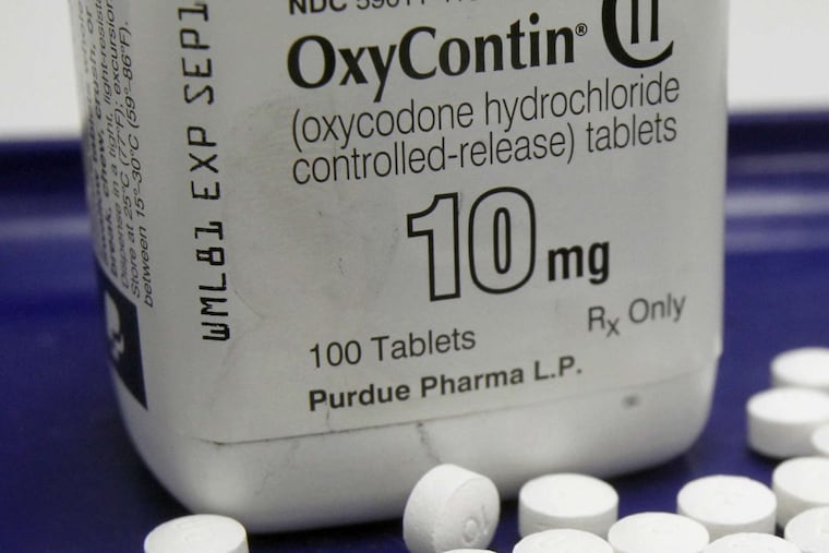 FILE – This Feb. 19, 2013, file photo, shows OxyContin pills arranged for a photo at a pharmacy in Montpelier, Vt. Prescription painkillers should not be a first-choice for treating common ailments like back pain and arthritis, according to new federal guidelines designed to reshape how doctors prescribe drugs like OxyContin and Vicodin. Amid an epidemic of addiction and abuse tied to these powerful opioids drugs, the CDC is urging general doctors to try physical therapy, exercise and over-the-counter pain medications before turning to painkillers for chronic pain. (AP Photo/Toby Talbot, File)