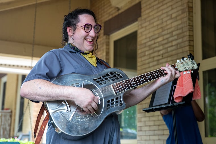 Dot Levine, of Dottie’s Serenade Service, opens up the performance with a Happy Birthday song to Michael Williams, who was celebrating his 70th birthday at his home in West Philadelphia on Friday, July 24, 2020.