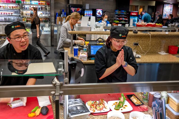 Husband and wife sushi chefs Josef and Evie Sutiono interact with diners during lunchtime at the Virtua Voorhees Hospital cafeteria as they prepare made-to-order rolls.
