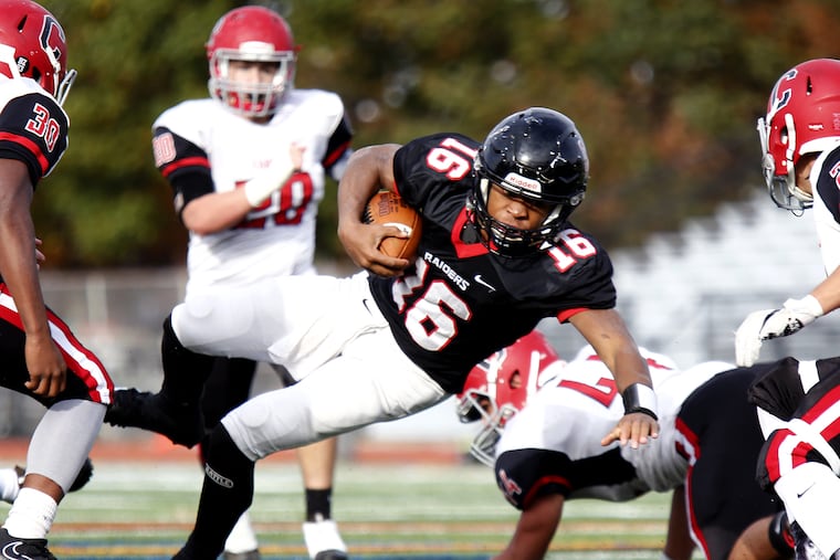 Archbishop Ryan quarterback Jahlil Sanders lunges forward for a gain against Archbishop Carroll during a Philadelphia Catholic League Class 5A football quarterfinal in 2017. Both of those schools will move forward with football this fall after a delay created by the coronavirus outbreak.