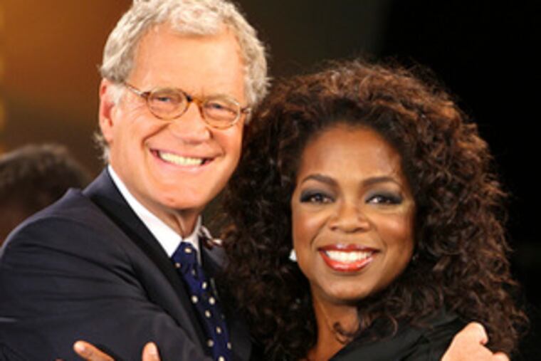 Oprah Winfrey welcomes first-time guest Letterman.