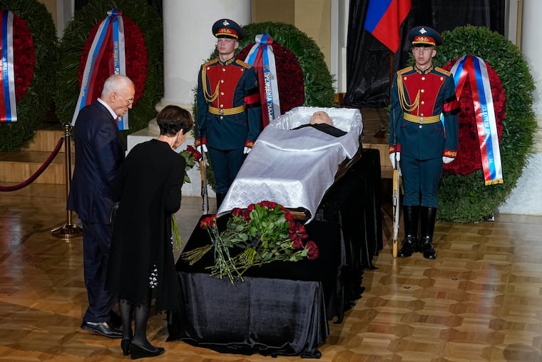 People stand by the coffin of former Soviet President Mikhail Gorbachev during a farewell ceremony in Moscow, Russia, on Saturday.