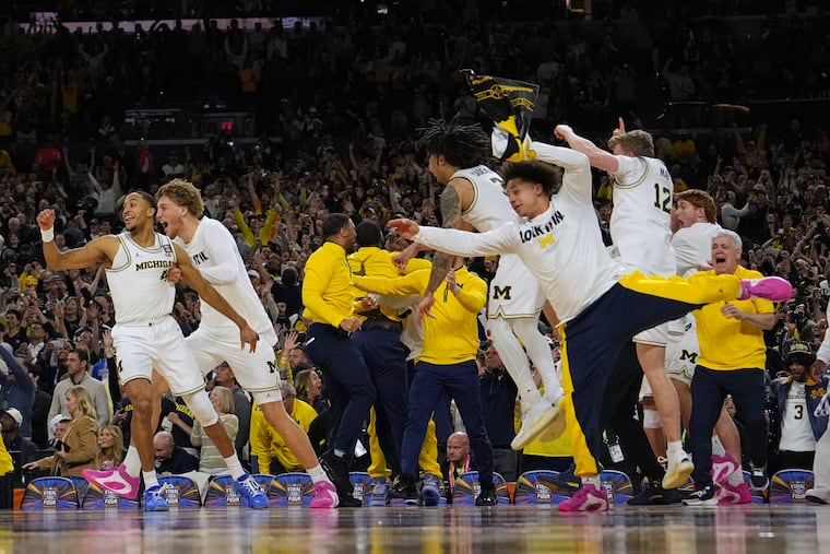 Michigan celebrates after defeating UConn in the national championship game in Indianapolis on Monday.