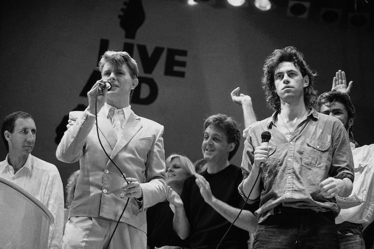 Bob Geldof (right) with Pete Townshend (from left), David Bowie, and Linda and Paul McCartney at the Live Aid famine relief concert at Wembley Stadium in London in July 13, 1985. Geldof, who organized the Live Aid concerts in Philadelphia and London and the Live 8 concerts in 2005 that were held in Philadelphia and other cities around the world, is being honored by the Philadelphia Music Alliance Walk of Fame. (AP Photo/Joe Schaber, File)