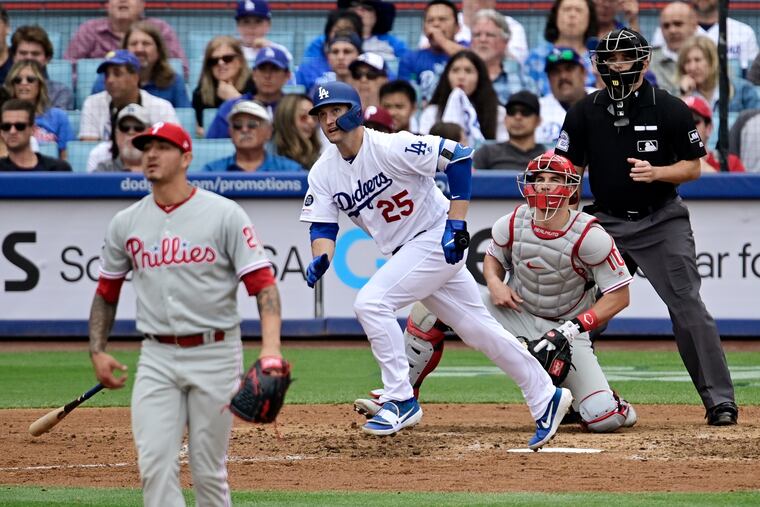 Vince Velasquez (left) allowed a two-run homer to David Freese in his latest bullpen appearance.