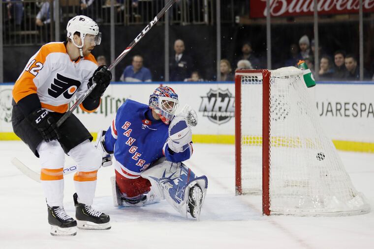 Michael Raffl scores a shorthanded goal past Henrik Lundqvist in Sunday's 5-3 win over the Rangers.