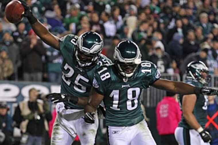 LeSean McCoy and Jeremy Maclin celebrate after McCoy's touchdown in the fourth quarter on Sunday. (Ron Cortes/Staff Photographer)