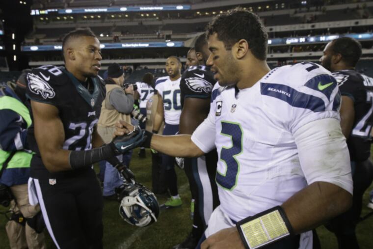 Cary Williams and Russell Wilson are teammates now. (Associated Press)