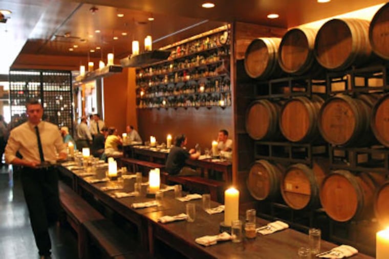 Beer casks on the wall are a prominent feature of the Farmers’ Cabinet dining room. (Michael Bryant / Staff Photographer)
