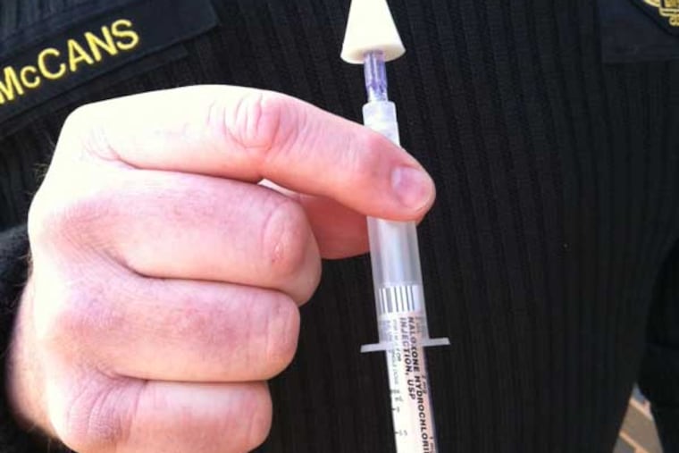 James P. McCans, paramedic director with Haverford Township, holds a dose of the nasal spray, naloxone, which rescuers use to reverse opiate drug overdoses.