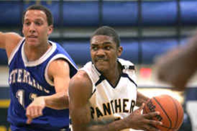 Collingswood's Tyrone Mann-Barnes drives past Sterling's Greg Visconti. The junior point guard scored 24 points, tying his career high, and had six assists and eight steals in the Panthers' victory.