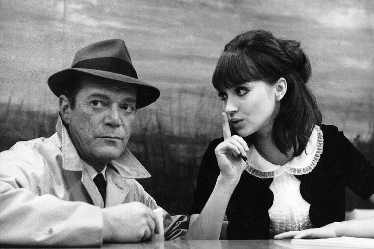 Eddie Constantine and Anna Karina star in Jean-Luc Godard's "Alphaville."