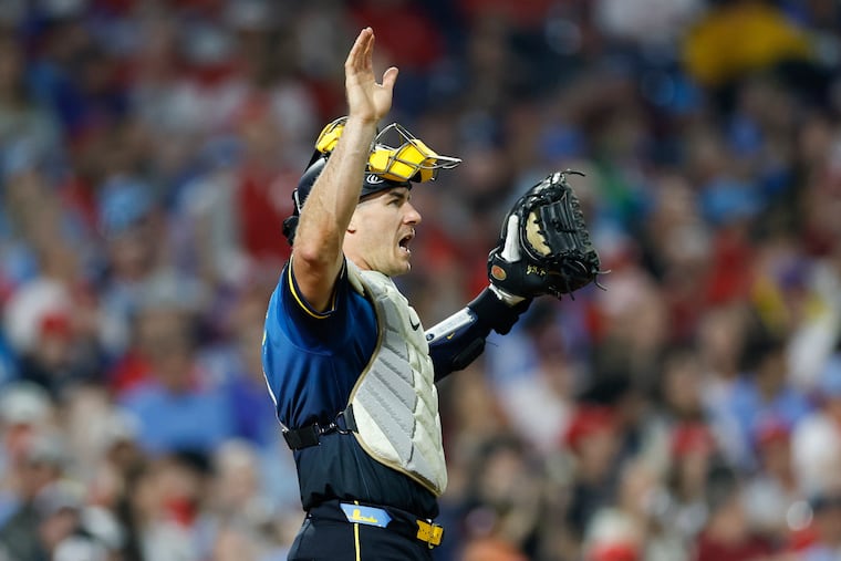 J.T. Realmuto signals to his Phillies teammates during a game against the Pirates on May 16.