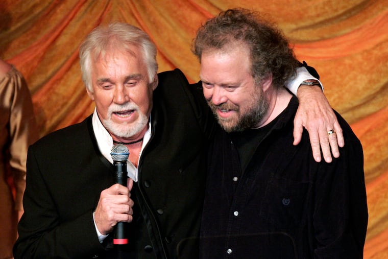 Kenny Rogers (left) presents the ASCAP Creative Achievement Award to songwriter Don Schlitz at the ASCAP Country Music Awards in Nashville on Oct. 15, 2007.