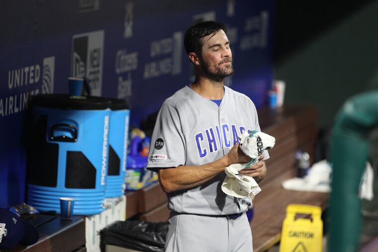 Cole Hamels stands frustrated in the visiting dugout after lasting just two innings in his first career start against the Phillies at Citizens Bank Park.