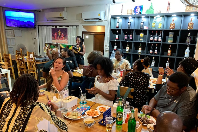 About 20 people of African descent living abroad gather for dinner at a Jamaican restaurant in Bangkok, Thailand to celebrate America’s newest federal holiday, Juneteenth on Saturday, June 18, 2022, in Bangkok, Thailand. As the United States marks only the second federally recognized Juneteenth, Black Americans living overseas have embraced the holiday as a day of reflection and an opportunity to educate people in their host countries on Black history.
