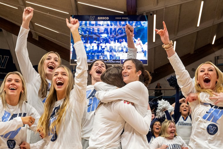 Maddy Siegrist (center right) embraces teammate Brianna Herlihy as Villanova's women's basketball team reacts to finding out they had qualified for the NCAA Tournament. The team held a watch party Sunday night at Finneran Pavilion.