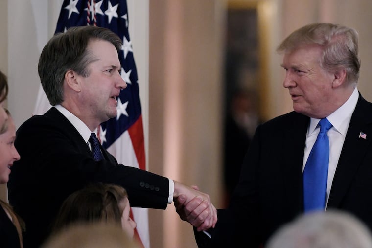 U.S. President Donald Trump shakes hands with Judge Brett Kavanaugh with after he nominated him to the Supreme Court during a ceremony in the East Room of the White House July 9, 2018 in Washington, D.C. (Olivier Douliery/Abaca Press/TNS)