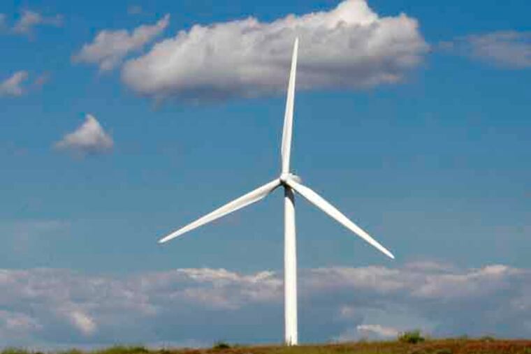 FILE - In this May 18, 2011 file photo, a wind turbine stands near Arlington, Ore. Renewable energy is growing fast around the world and will be the second biggest source of electricity, after coal, by 2016, according to a five-year outlook published Wednesday, June 26, 2013, by the International Energy Agency. (AP Photo/Rick Bowmer, File)