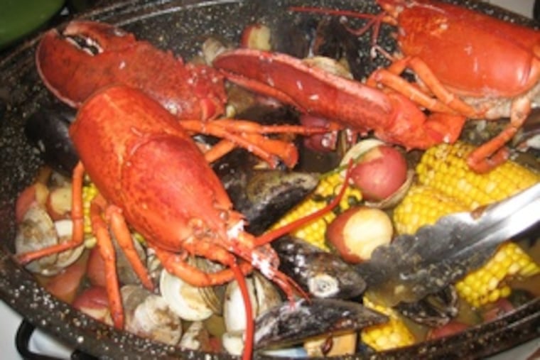 You don't need to be beside the sea to savor a party clambake - just fire up the grill and add lobsters, mussels, clams, potatoes, corn, chorizo, parsley, and a generous shake of Old Bay.